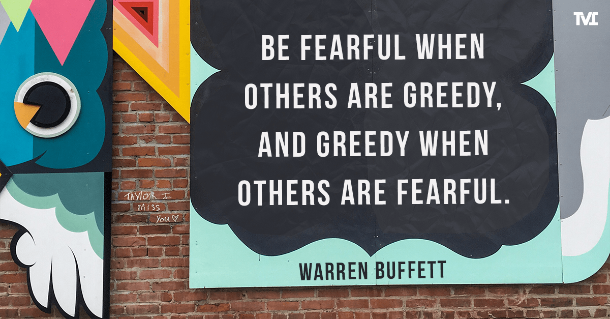 Warren Buffet quote on colorful wall: 